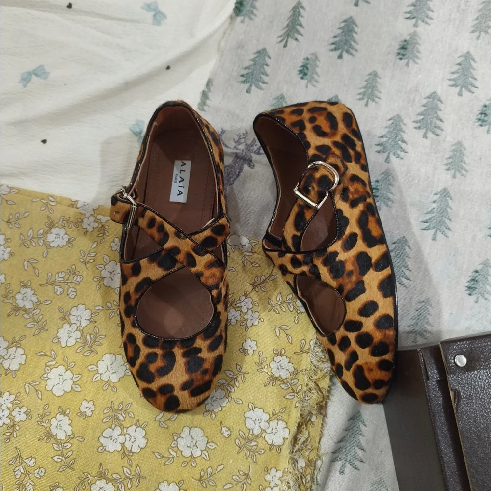 Alaia Leopard-Print Mary Jane Flats in Brown and Black